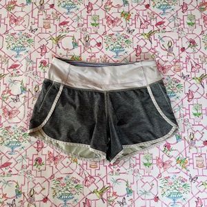 Grey and Purple Lululemon Speed ups- Fair condition with one small spot- Size 2